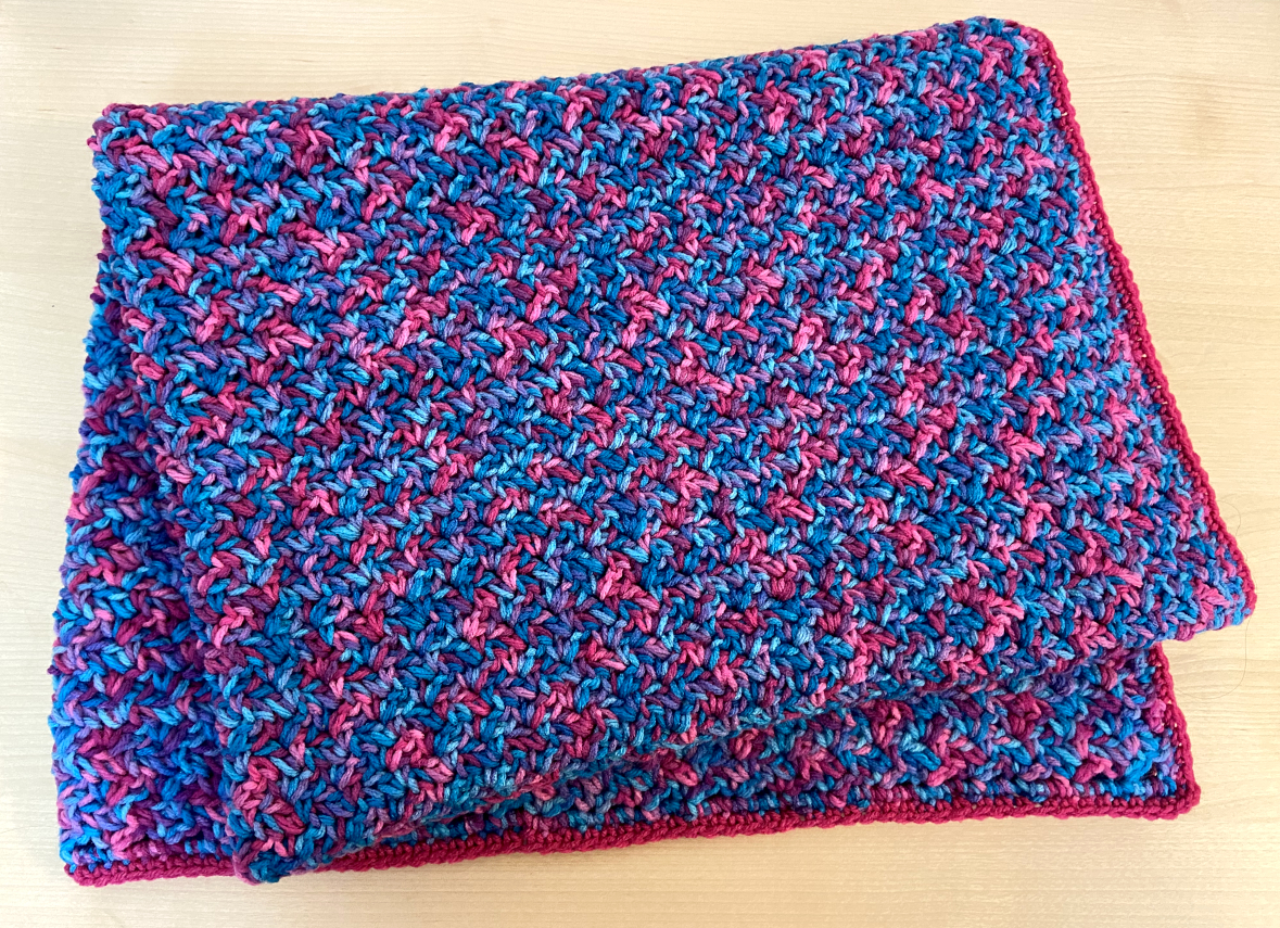 pink and blue crochet blanket